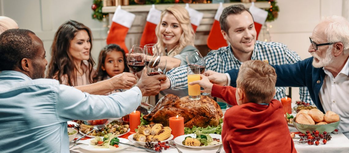 Family celebrating Holidays at dinner table